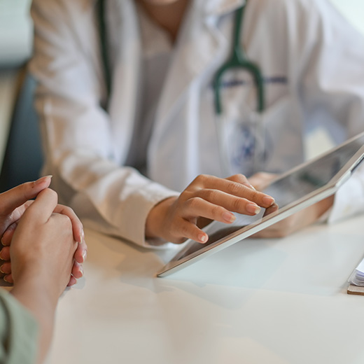 doctor consulting patient using tablet in healthcare setting