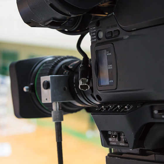 close-up of a professional video camera highlighting the lens and control panel showcasing advanced filming features three camera settings